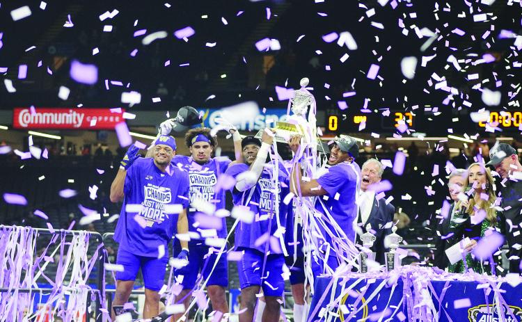 Offensive MVP Michael Penix Jr. along with Defensive MVP Bralen Trice and other members of the Washington Huskies hoist the Allstate Sugar Bowl Trophy after a 37-31 win over the Texas Longhorns. (Gazette photo by Tony Marks)