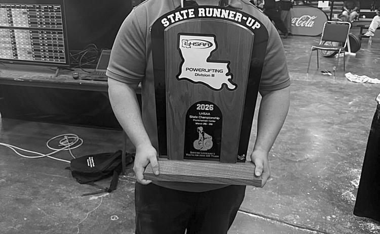 Mamou head powerlifting coach Kirk Taylor is pictured with this year’s girls’ state runner-up trophy. (Photo courtesy of Kirk Taylor)