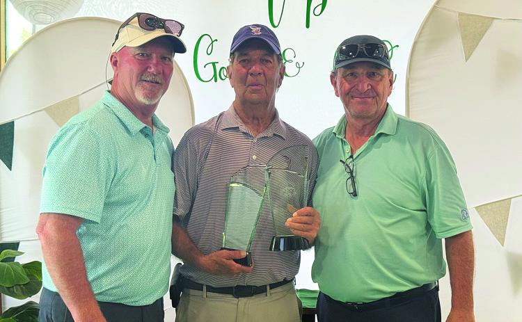 Ted Smith is pictured in the center with his trophies after winning the Ville Platte Golf and Country Club Championship. He is pictured with board member Brian LaFleur on the left and President T-Joe Fontenot on the right. (Photo courtesy of Ted Smith)