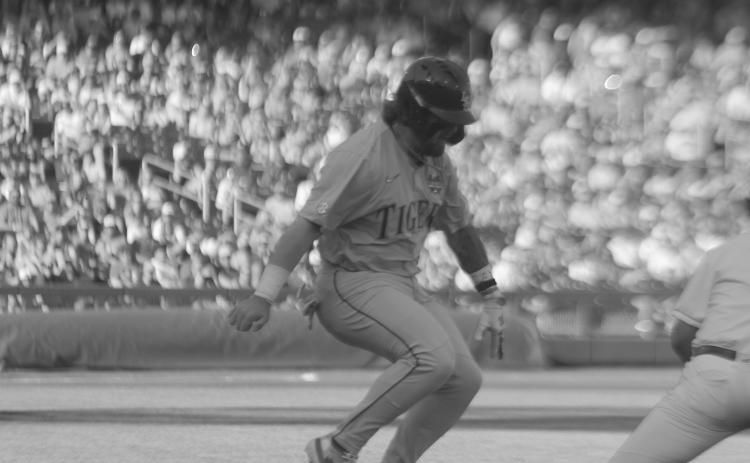LSU’s Tommy White attempts to leg out an infield single in the Tigers’ loss to Wake Forest on Monday. White, in a rematch against the Demon Deacons, delivered a home run to send his team to the best-of-three finals. (LSN photo by Tony Marks)