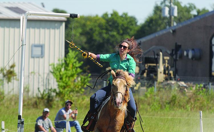 Marie Toustou, a native of the South of France, is pictured as she tries to collect one of the seven rings during the Tournoi qualifying held Sunday, September 26, at the Industrial Park in Ville Platte. (Gazette photo by Tony Marks)