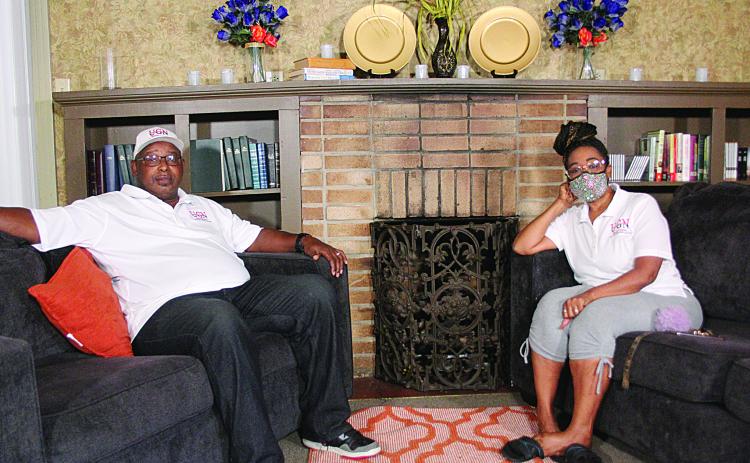 UGN Production Manager John Richard (left) sits with Deetra Randle (right) on the set of UGN Broadcasting in Ville Platte. Randle is the wife of the company’s founder, Samuel “Tendeep” Randle. (Gazette photo by Tony Marks)