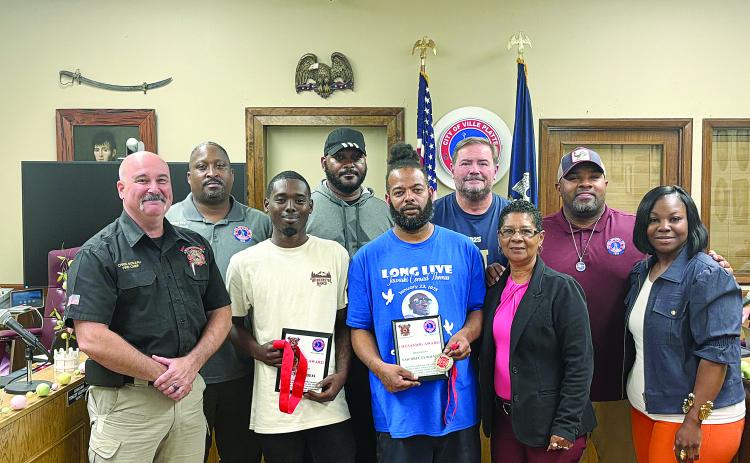 Pictured from left are (back row) Councilman Shawn Roy, Councilman Bryant Riggs, Councilman Tracey Jagneaux, and Mayor Ryan LeDay Williams; (front row) Fire Chief Chris Soileau, Jujaun Ben, Van Drecus Wilson, Councilwoman Anna Frank, and Councilwoman Christina Sam. (Gazette photo by Tony Marks)