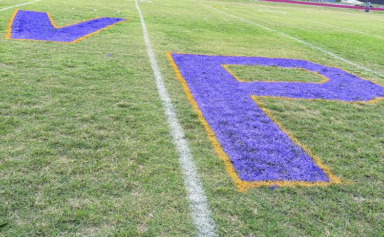 Pictured are a purple “V’ and “P” that were painted at midfield for the Ville Platte High homecoming game against Church Point. The game was interrupted and cancelled because of gun shots. (Gazette photo by Tony Marks)