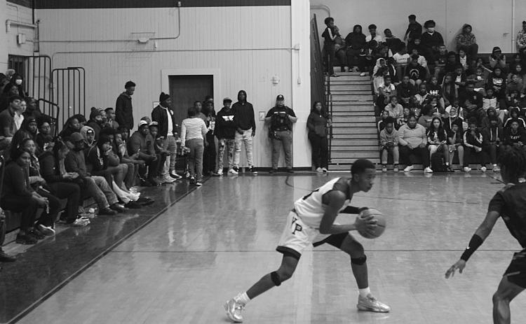 Sage Papillion (22) sets up a play for the Bulldogs of Ville Platte High against Opelousas.