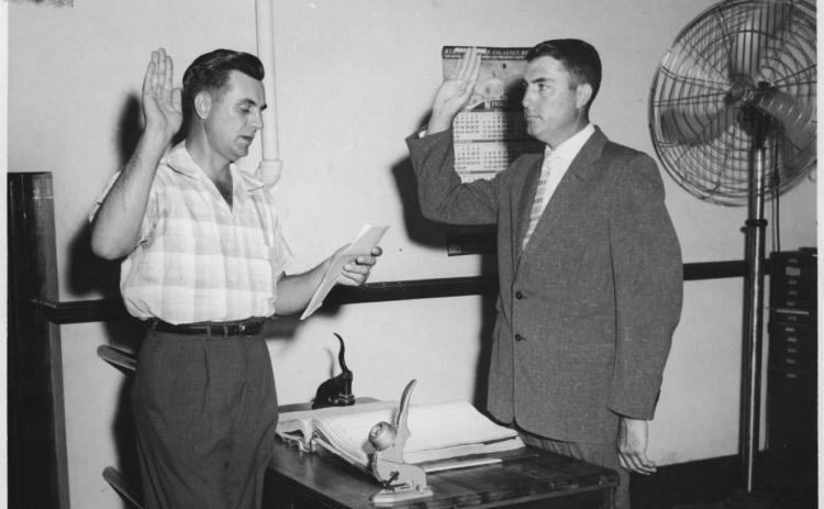FROM THE ARCHIVES - Walter Lee (right) was sworn in for his first term as Evangeline Parish Clerk of Court on June 1, 1956, by his predecessor Richard Reed. Lee would go on to serve in the role for 56 years. (Gazette file photo)