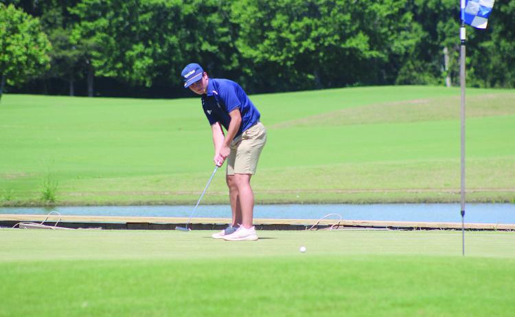 William Chapman is pictured as he tries to make a putt during the first round of the state golf tournament on Monday, May 4, in Carencro. (Gazette photo by Tony Marks)