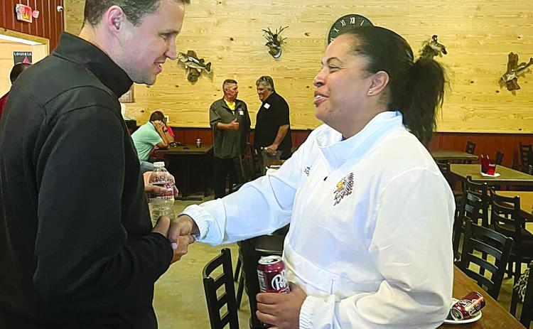 Newly hired McNeese mens’ basketball coach Will Wade (left) meets with the head coach of the State Champion Oakdale Lady Warriors Renotta Edwards. (LSN photo by Tony Marks)