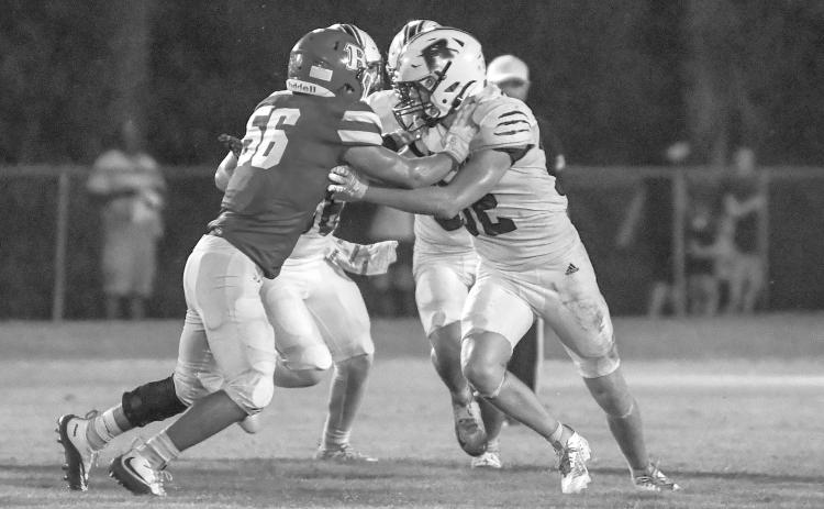 Basile’s William Ashford (56) goes head to head with a Rosepine Eagle during last week’s home opener. The Bearcats host Port Barre this week for Homecoming. (Photo by Tonya Ortego)