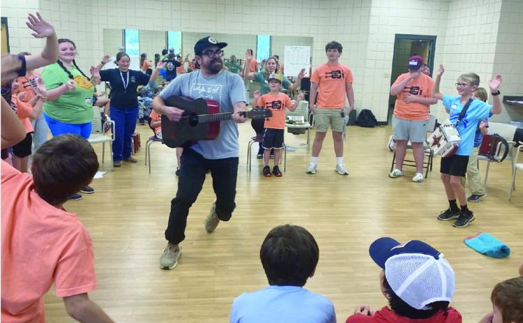 Joseph “Jo” Vidrine is pictured as he inspires youth musicians at Kids’ Camp in Eunice. (Photo by Zeta McCaskill)