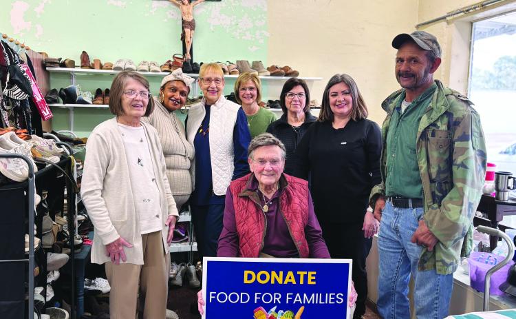Volunteers at the Christian Care and Share Center are preparing for the 39th Annual Food For Families Drive, which will be held Tuesday, November 9. Seated in front is Eugene Fontenot. Standing in back, from left, are Sarah Webb, Melissa Arvie, Becky Miller, Michelle David, Liz Vidrine, Kaera Doucet and Hillery Richard. Not pictured are Mary Freeman, Eva Smith, Rose Fontenot, Monette Richardson, Sharlene Znamierowski, Claudia Ortego, and Darlene Soileau. (Gazette photo by Heather Bogard)