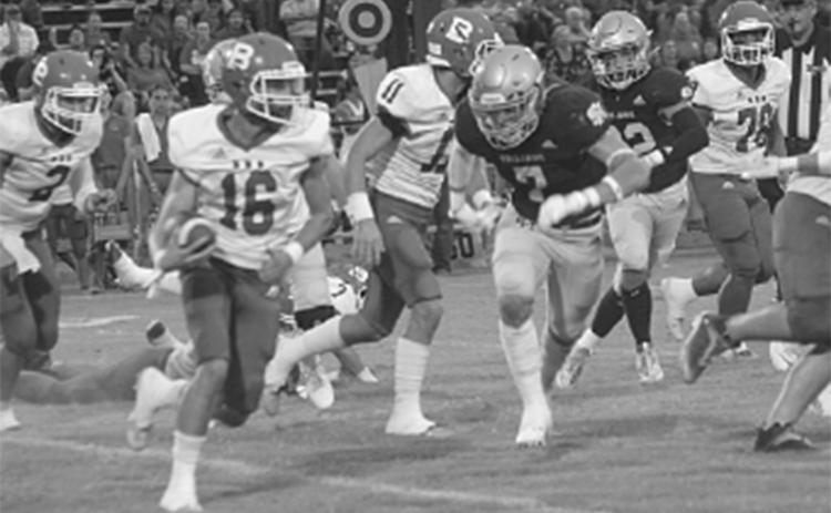 Bearcat Gage Craton (16) attempts to get around Sacred Heart Trojan Cole Tate (7) in non-district play earlier this season. (Gazette photo by Rhett Manuel)