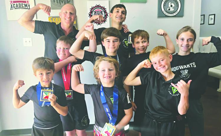 INNER GAME STUDENTS DO WELL IN TOURNAMENT - Several students from Inner Game Jiu-Jitsu participated in a tournament in Lafayette on Saturday, April 11, and had a great showing. Above, Coach Robbie Stevens (top left), Charlie and Leah Stevens (right) and students (in no particular order) Bodhi Vidrine, Oliver Sonnier, Jeremiah Trahan, Kason Castille, Easton Sonnier and Eli Lafleur share a celebratory photo. (Photo courtesy of Robbie Stevens)