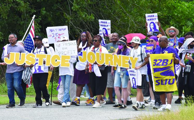 PROTESTORS MARCH AT LOCAL GEO DETENTION CENTER - Joseph Bryant, international executive director of SEIU (far left), was among the 300 that gathered on East Stagg Avenue in front of the local detainee center back in July of this year. (Photo by Robert Stewart, Verite News)