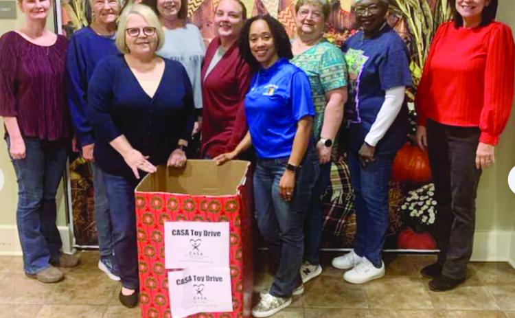 EVANGELINE PARISH LIBRARIES SUPPORTING CASA TOY DRIVE - (left to right) Angie Henry of the Pine Prairie branch, Ruth Stanley and Gigi Fontenot of the Mamou branch; Sherry Bergeron, Basile branch; Amy King, Turkey Creek branch; Keisha Ford, Jane Vidrine, and Patricia Harris, all of the main library in Ville Platte, and Rebecca Leger, Basile branch.