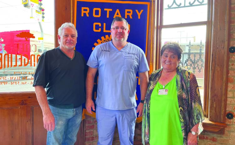 DR. CORMIER DISCUSSES STISOL - During the December 20, meeting of the Ville Platte Rotary Club, Dr. Jeb Cormier (center) spoke with the group about services at his STISOL clinic in Ville Platte. He is shown with Rotary President Larry Lachney (left) and Rotarian Mable Foreman (right). (Gazette photo by Heather Bogard)