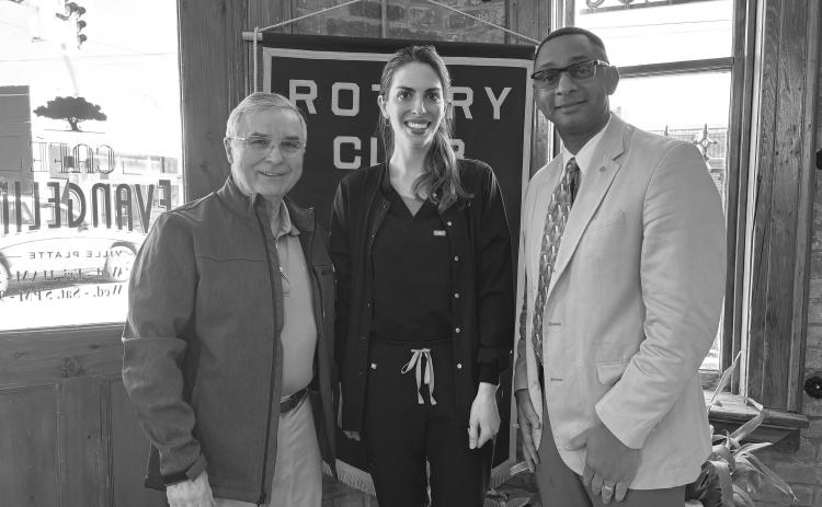 Shown, from left, are Rotarian Dr. Kirk Soileau, Natalie Turk and Rotary President Brian Ardoin. Turk spoke about her experience as a dental hygienist working for Dr. Soileau for the past three and a half years. (Gazette photo by Heather Bogard).