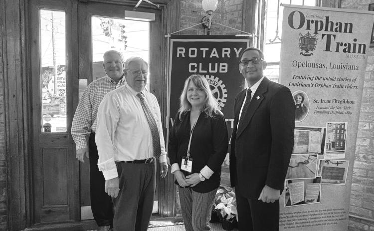 HISTORY OF ORPHAN TRAIN PRESENTED -  Shown, from left, are Rotarians Peter Strawitz, James Douget, Martha Aubert and Rotary President Brian Ardoin.Douget and Aubert with the Orphan Train Museum talked about the history of the Orphan Train. (Gazette photo by Heather Bogard).