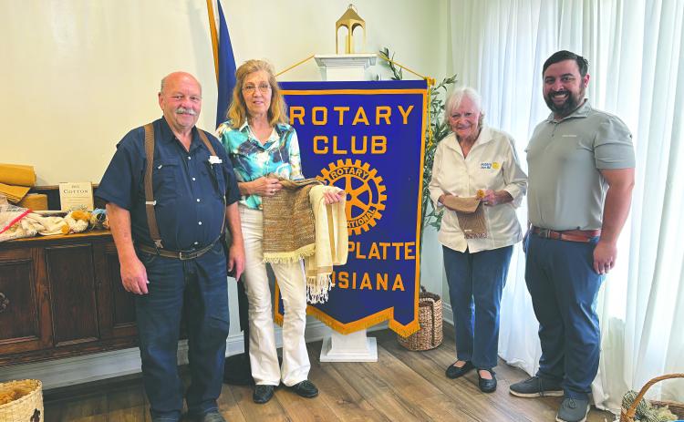 PASSION FOR COTTON SHARED - Belinda Berzas and Mavis Fruge shared their passion for cotton weaving and spinning to make various items. Shown from left, are Rotarian Bob Manuel, Belinda Berzas, Mavis Fruge and Rotary President Beau Wilson. (Gazette photo by Heather Bogard)