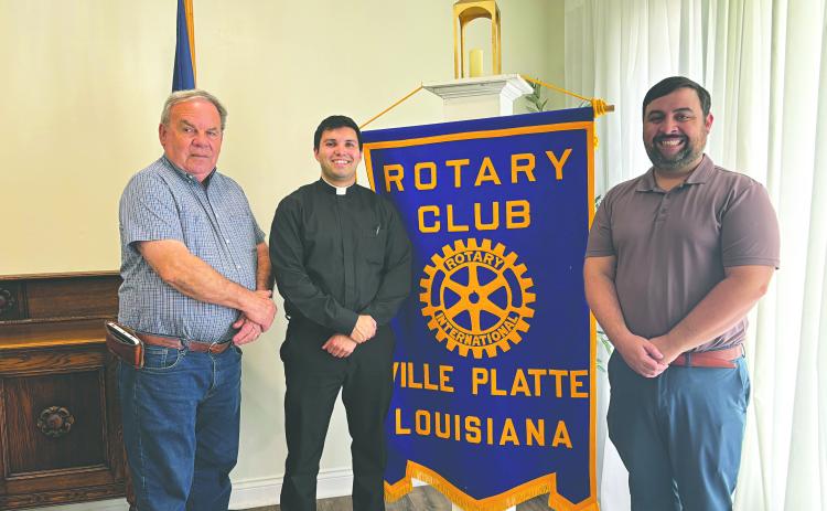 SEMINARIAN FORMATION DISCUSSED - Father Alex Lancon (center) was the guest speaker for the March 24, meeting of the Ville Platte Rotary Club. He is shown with Rotarian Steve Phillips (left) and Rotary President Beau Wilson (right). (Gazette photo by Heather Bogard)