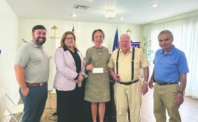 LSUE SCHOLARSHIP PRESENTED - During the April 28, meeting of the Ville Platte Rotary Club, Rotarian Dr. Willie Buller and Rotary President Beau Wilson presented the annual Ville Platte Rotary scholarship donation to the LSUE Foundation. Shown, from left, are Wilson, LSUE Foundation Executive Director Carey Lawson, LSUE Chancellor Dr. Nancee Sorenson, Dr. Buller, and Rotarian Dr. Kirk Soileau. (Gazette photo by Heather Bogard)