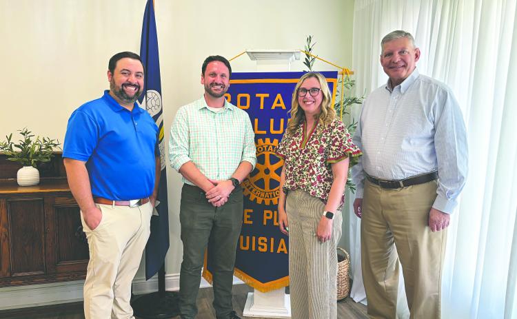 NEW BOOKSTORE TO OPEN IN VILLE PLATTE - Seth and Jessica Deen Norris (center) visited the May 12, meeting of the Ville Platte Rotary Club to share their journey to opening a new bookstore in town. Rotary President Beau Wilson (left) and Rotarian Peter Strawitz (right). (Gazette photo by Heather Bogard)
