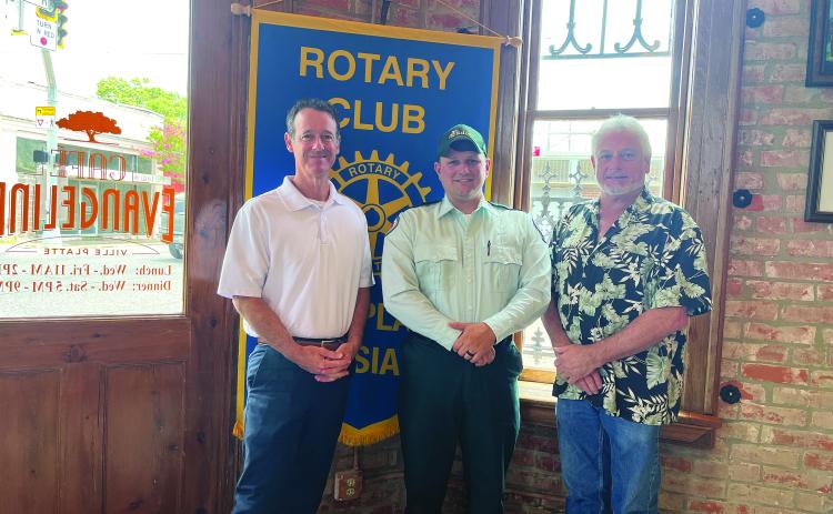 ACADIAN AMBULANCE SERVICES DISCUSSED - Jacques Dupre, center, visited the July 5, meeting of the Ville Platte Rotary Club to discuss his career with Acadian Ambulance. He is shown with Rotarian Richard Lejeune, left, and Rotary President Larry Lachney, right. (Gazette photo by Heather Bogard)