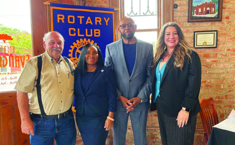 CHILDREN’S TRUST FUND WORK SHARED - Shown, from left, are Rotary President Bob Manuel; guest speaker Ursula Anderson, Executive Director of the Louisiana Children’s Trust Fund; Rotarian Clem LaFleur; and guest speaker Amanda Shackelford with LYFE.  (Gazette photo by Heather Bogard)