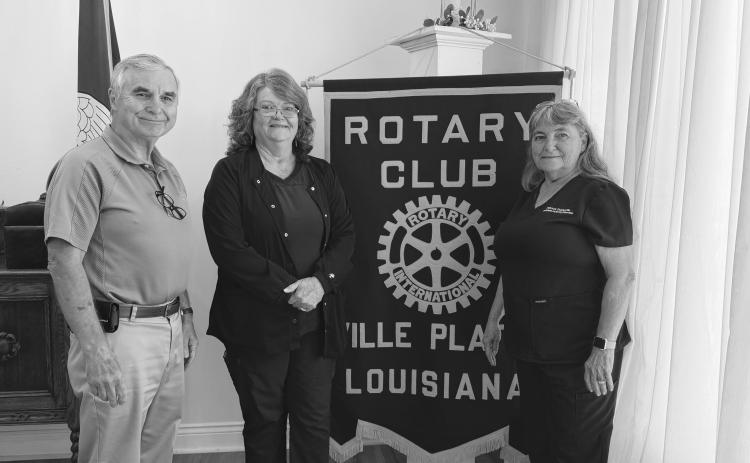 NURSING HOME ADMISSIONS ADDRESSED - During the July 28, meeting of the Ville Platte Rotary Club, Melanie Wolff, admissions coordinator at Heritage Manor Nursing Home, was the guest of Rotarian Patricia Duplechin (right). They are shown with Rotary President Dr. Kirk Soileau (left). (Gazette photo by Heather Bogard)