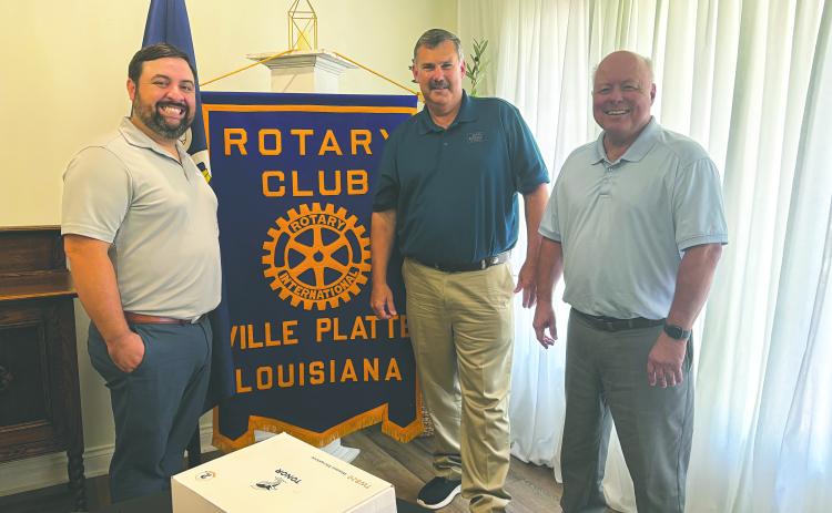 STATE OF AGRICULTURE DISCUSSED - Farm Bureau President Richard Fontenot discussed agriculture during the July 29, meeting of the Ville Platte Rotary Club. He is shown with Rotary President Beau Wilson (left) and Rotarian Dr. Hosea “Joey” Soileau (right). (Gazette photo by Heather Bogard)