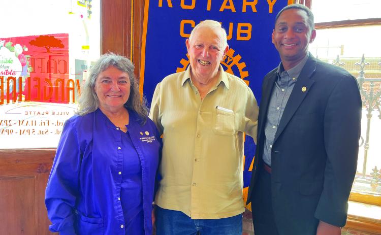 HILL DISCUSSES VFW - VFW Post #3803 Quartermaster Hillery Hill (center) visited the August 1, meeting of the Ville Platte Rotary Club as the guest of Rotarian Patricia Duplechin (left). They are shown with Rotary President Brian Ardoin (right). (Gazette photo by Heather Bogard)