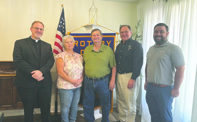HISTORY OF VILLE PLATTE ROTARY CLUB SHARED - Shown, from left, are honorary Rotarians Father Mitchell Guidry, Darlene Bolfa and Ray Duplechain, Rotarian Wayne Vidrine and Rotary President Beau Wilson. Vidrine shared a brief history of the club during the August 26 meeting. (Gazette photo by Heather Bogard)
