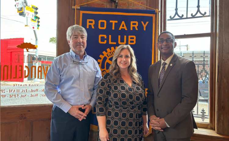 STATE ISSUES DISCUSSED - Dr. Erin Bendily with the Pelican Policy Institute for Public Policy (center) was the guest speaker for the November 7, meeting of the Ville Platte Rotary Club. She is shown with Rotarian Jimmy LeBlanc (left) and Rotary President Brian Ardoin. (Gazette photo by Heather Bogard)