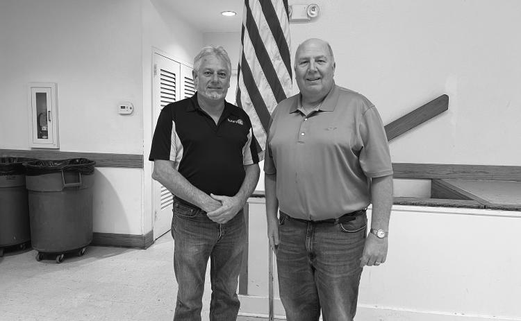DEROUSELLE TALKS 911 SERVICES - During the December 13, meeting of the Ville Platte Rotary Club, Pat Derouselle (right) spoke with the group about 911 services in Evangeline Parish. He is shown with Rotary President Larry Lachney (left). (Gazette photo by Heather Bogard)