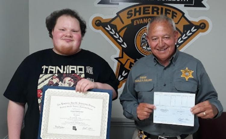 Pictured on the left is scholarship recipient Sawyer Gunter with Evangeline Parish Sheriff Charles Guillory. The scholarship was an academic scholarship from the Louisiana Sheriffs’ Scholarship Program. (Photo courtesy of EPSO)