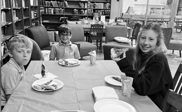 From left, are Merritt Deville, Everett Fontenot and Audrey Caulkins. They enjoyed pizza in the library as they were among the top accelerated readers for the first nine weeks. (Photo courtesy of Jan Veillon)