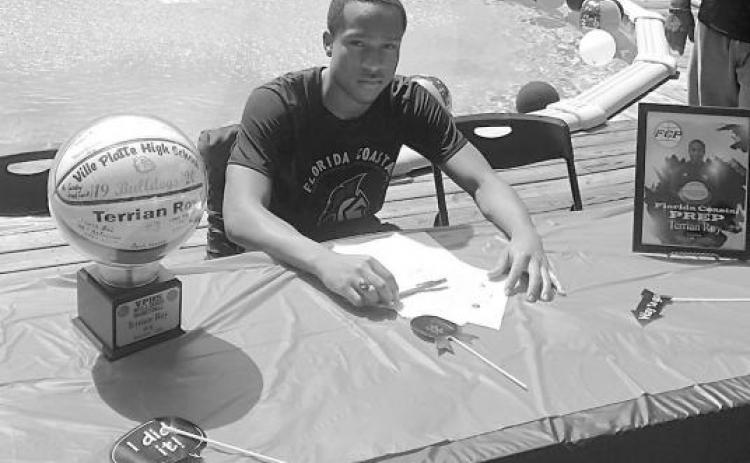 Former Ville Platte High basketball standout, Terrian Roy, signs his letter of intent to play for Florida Coastal Prep in Fort Walton Beach. Since then, he has accepted a scholarship to play for Utah State University Eastern in the National Junior College Athletic Association. (Photo courtesy of Tommy Jones)